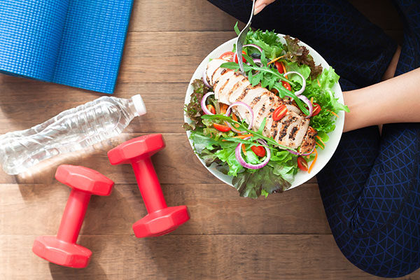 A salad, weights, and water