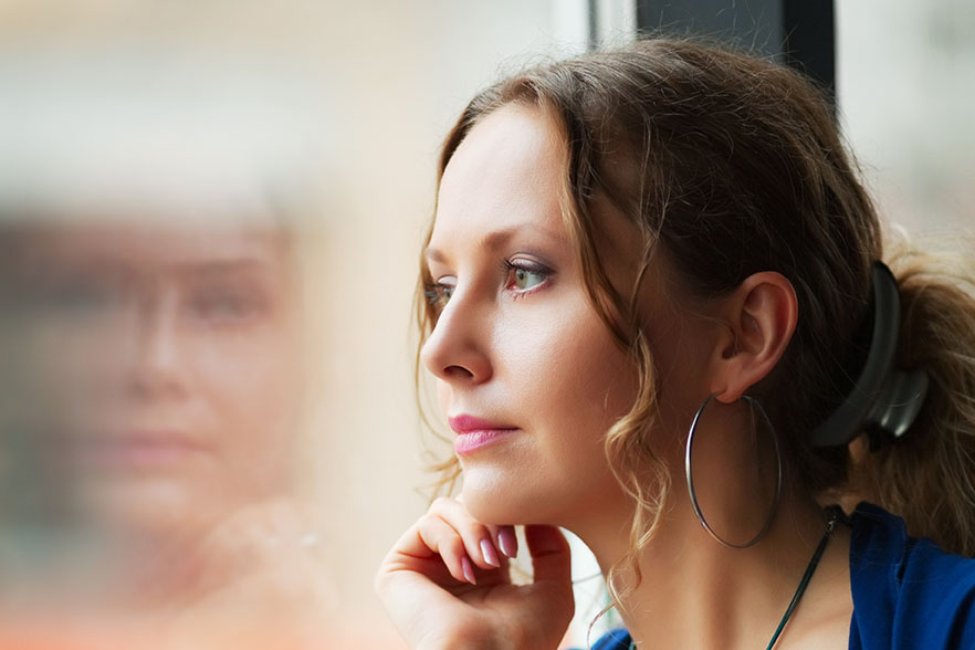 Woman looking out the window